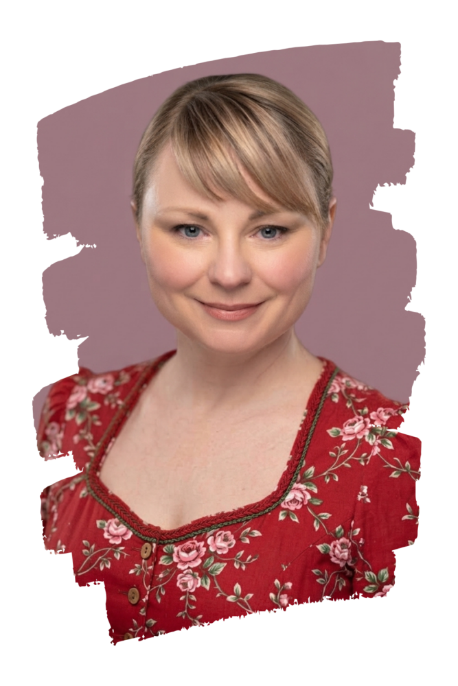 Yvonne Schütt, Autorin und Illustratorin, lächelt freundlich in die Kamera, trägt eine rot-geblümte Bluse